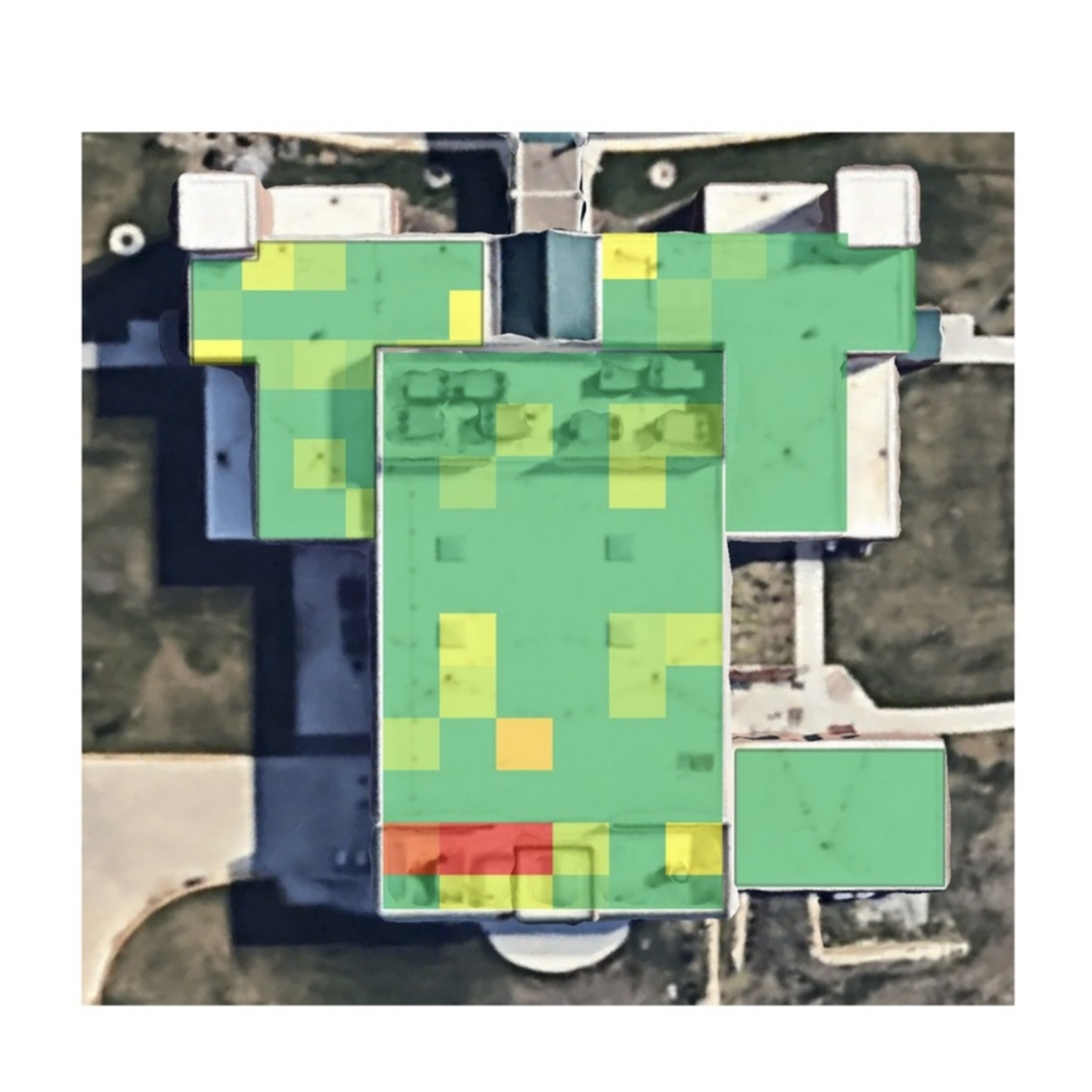 Commercial roof with Roof MRI moisture heat map showing green, yellow, and red zones