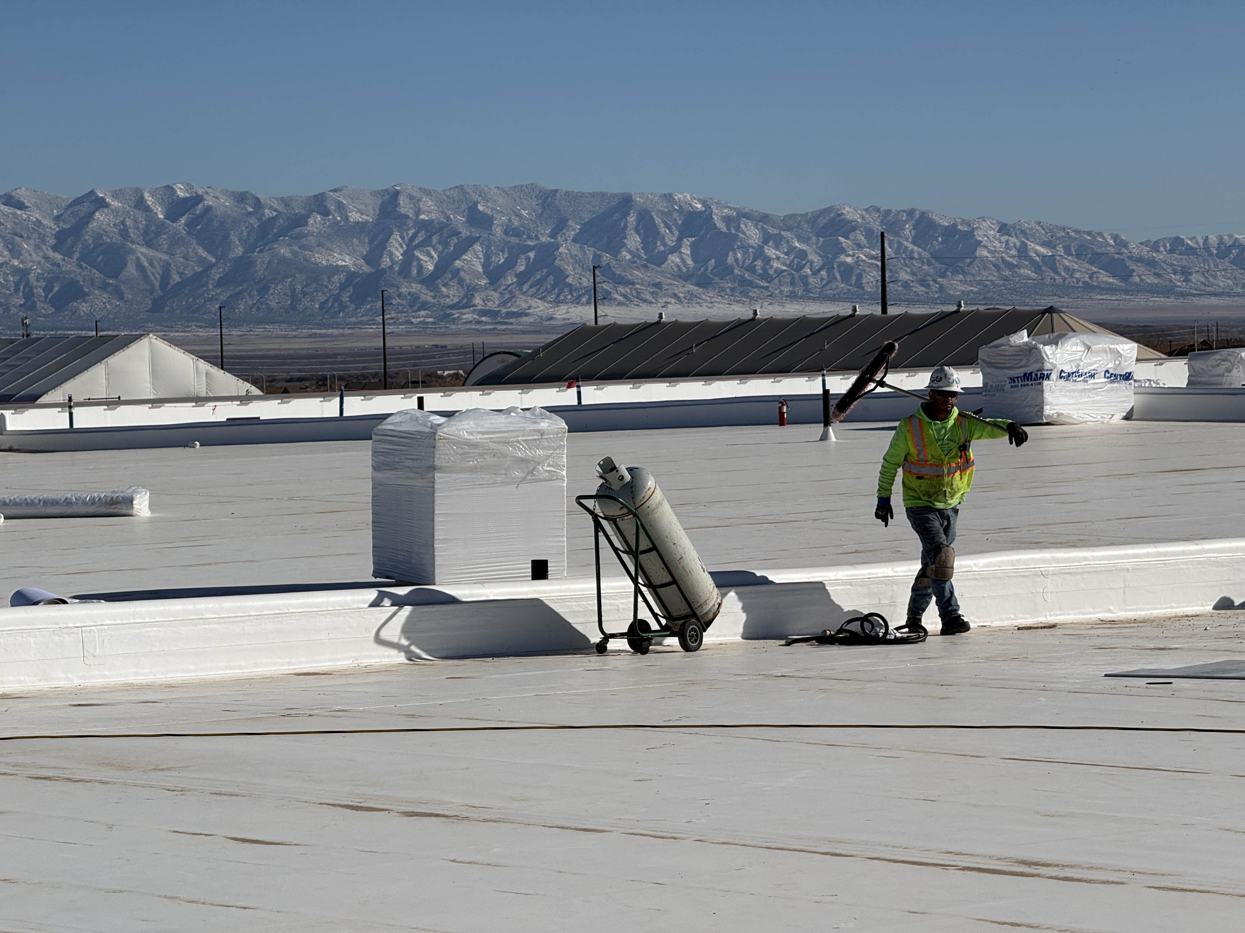 Roofing professional on a commercial roof